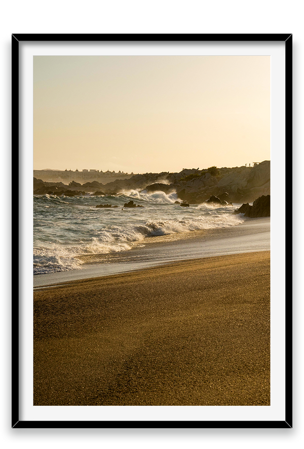 Waves crashing on sand, golden hour